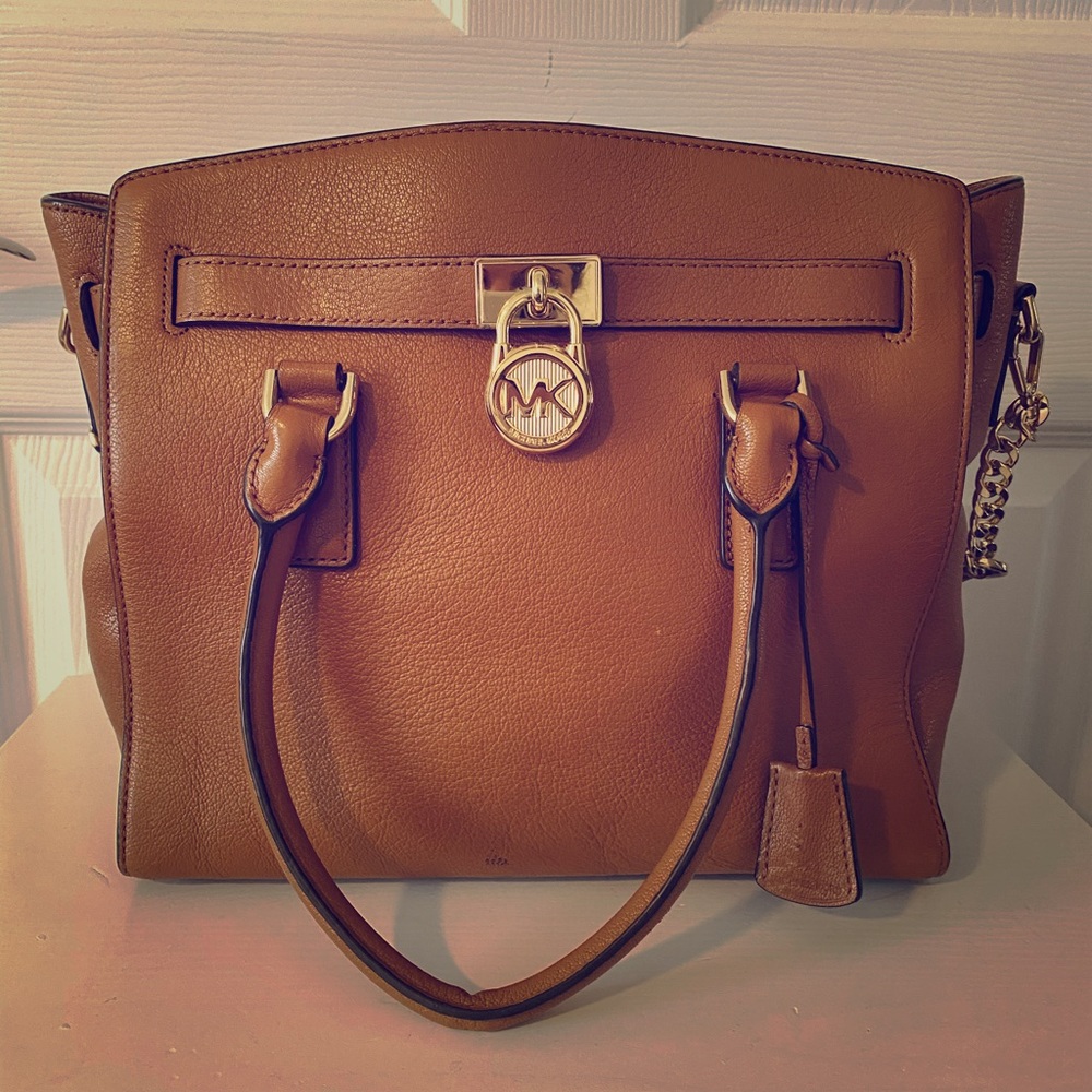 Leather Michael Kors purse in tan.